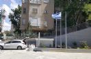 תורן פלדה קוני בגובה 6 מטר התקנה עם פלטות חיבור לדופן אדנית במגדל גפן ברמת גן